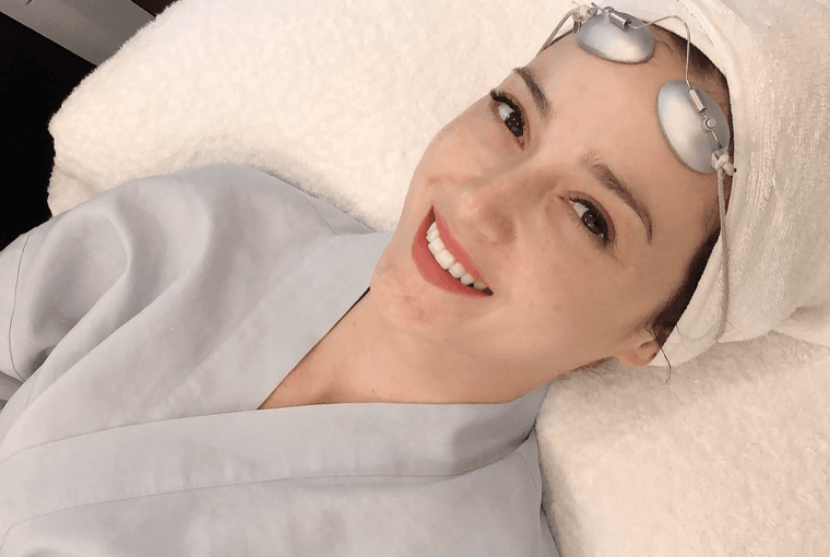 Close up of Julie Estelle wearing a grey robe at Blink Beauty clinic about to get picosure pro laser treatment.