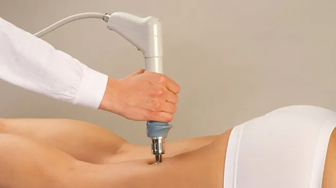 Picture of xwave being applied to womans lower thigs at Blink Beauty Clinic