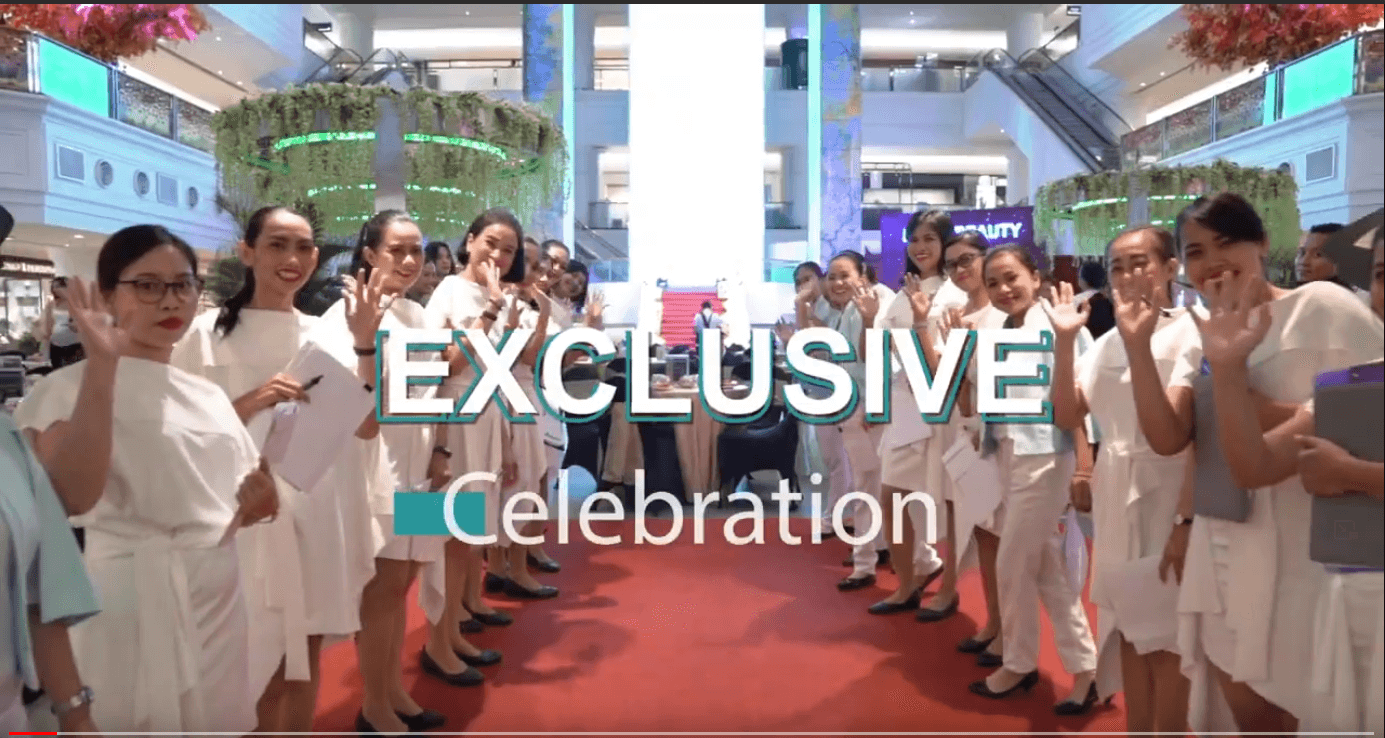 Photo still of a Blink Beauty Clinic celebration at Plaza Indonesia with their staff waving at the camera